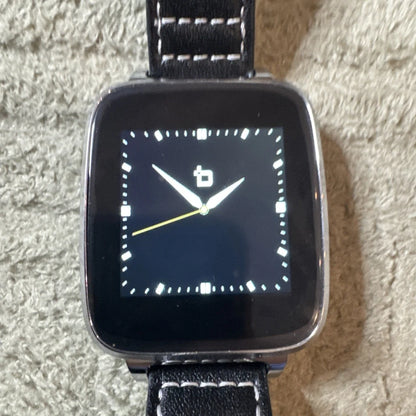 Bit Smart Watch Model S1 with black screen, silver bezel, black leather strap