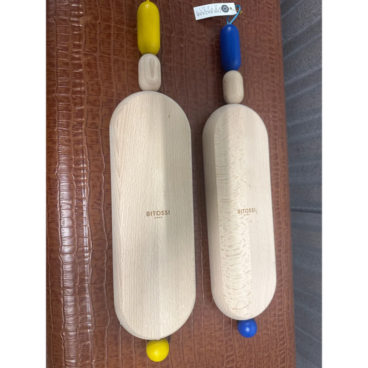 Colorful beads with wooden decorative objects from Bitossi Home Bijoux cutting board set