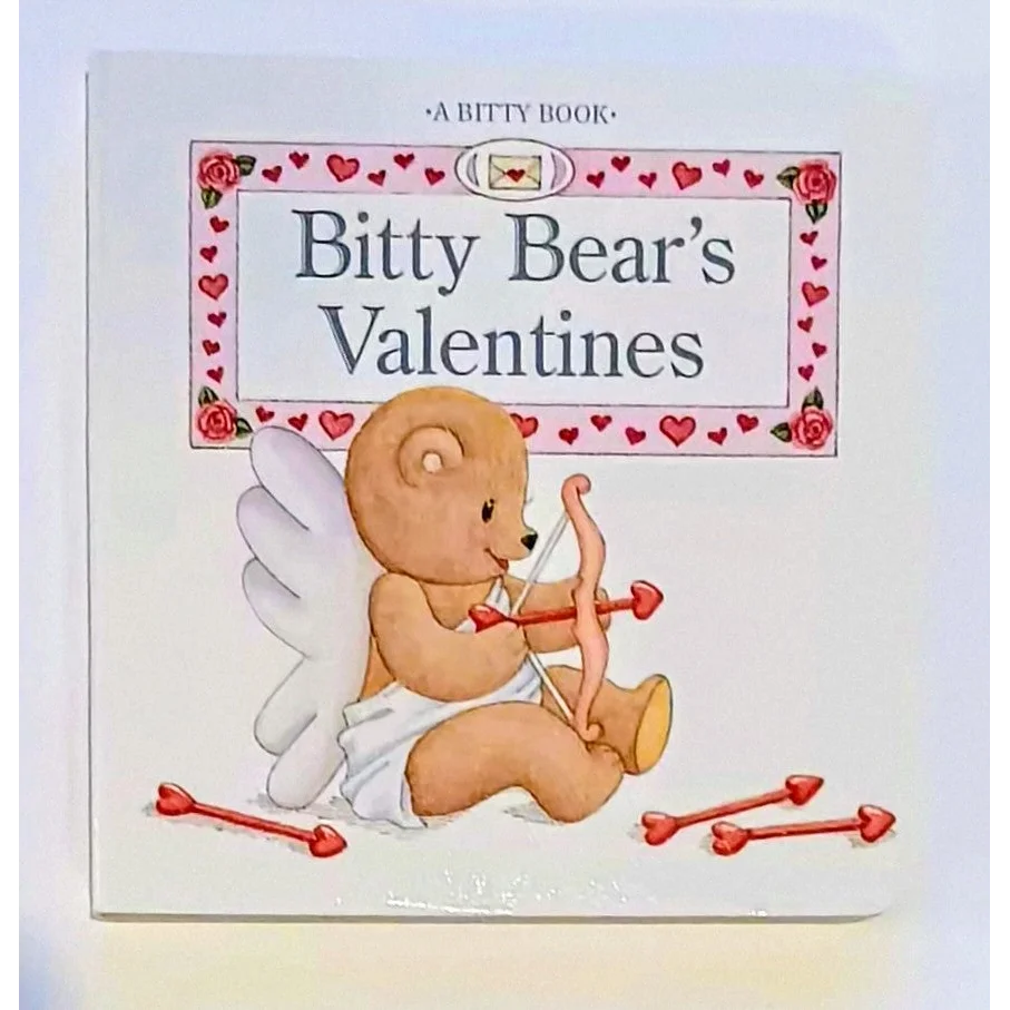 Cute Bitty Baby bear in diaper with wings holds arrow on valentines board book cover
