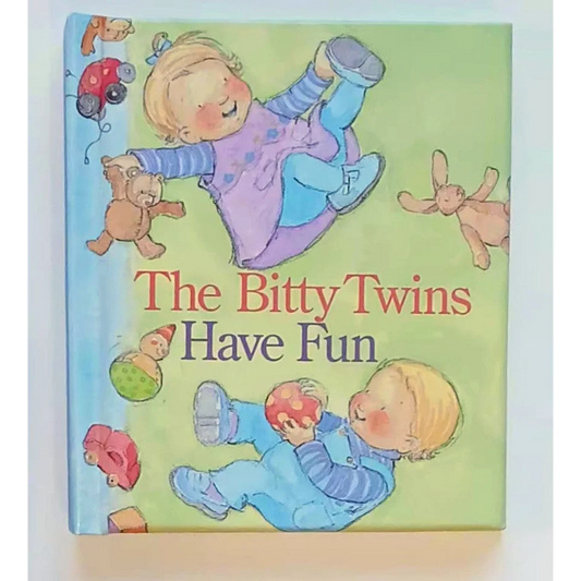 Cheerful Bitty Twins playing with toys on baby HC Bitty book cover