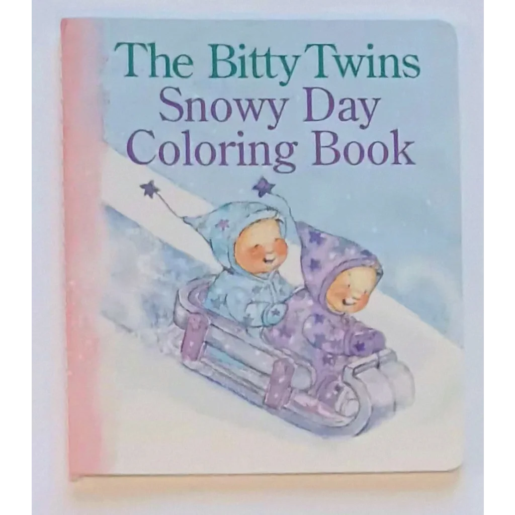 Bitty Twins Snowy Day coloring book with pink cover and sledding twins