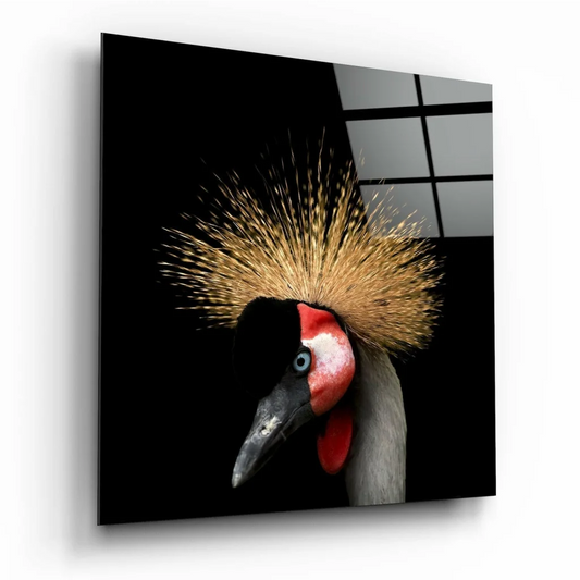 Crowned crane glass wall art with golden feathers in black-and-white frame