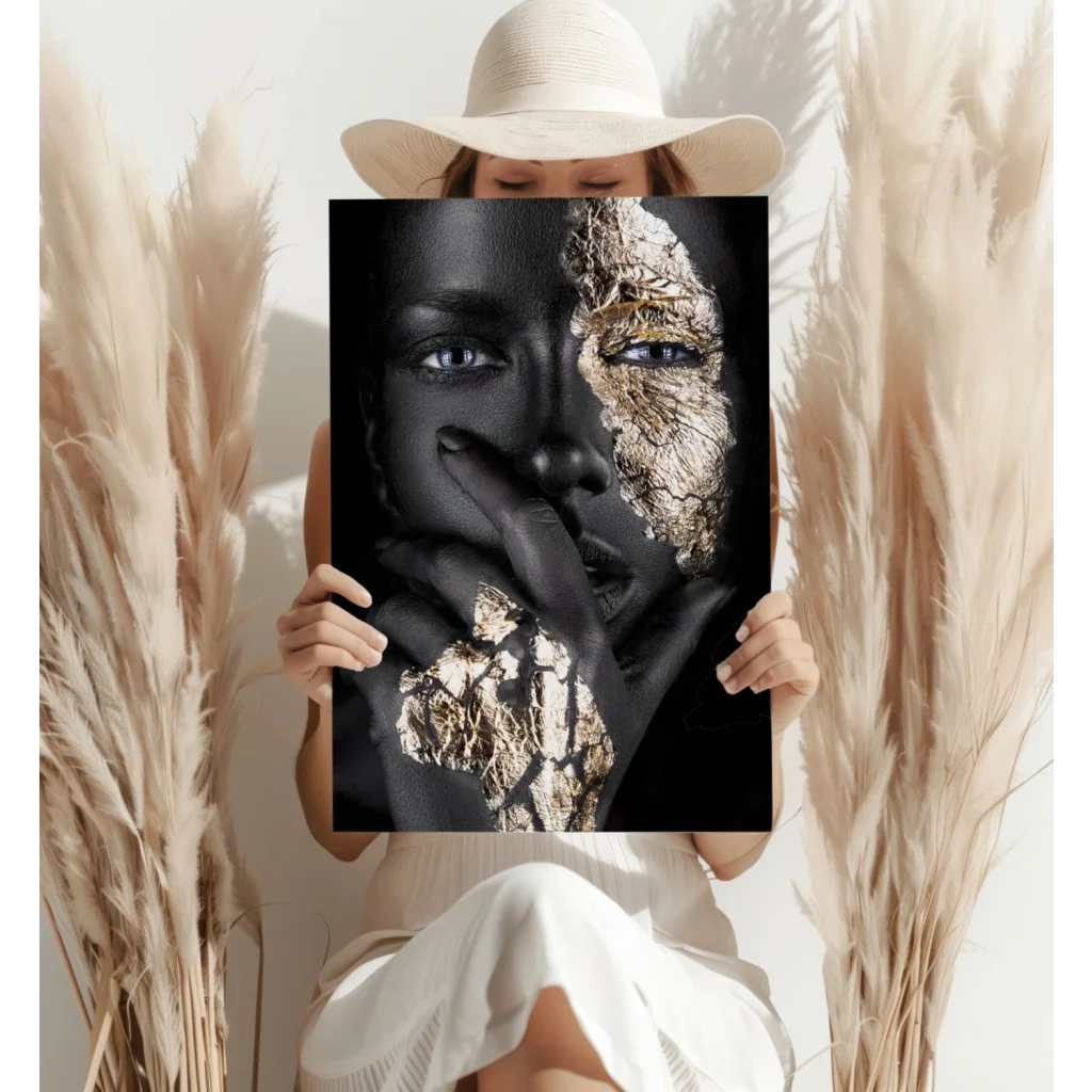 Striking black gold split face portrait canvas art with womans bold blue eyes