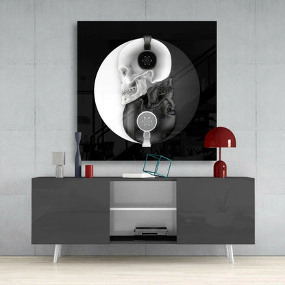 Yin yang skulls glass wall art with headphones on gray console