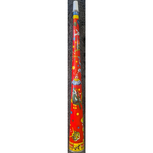 Colorful didgeridoo with vibrant Aboriginal art next to a retro tin horn noisemaker