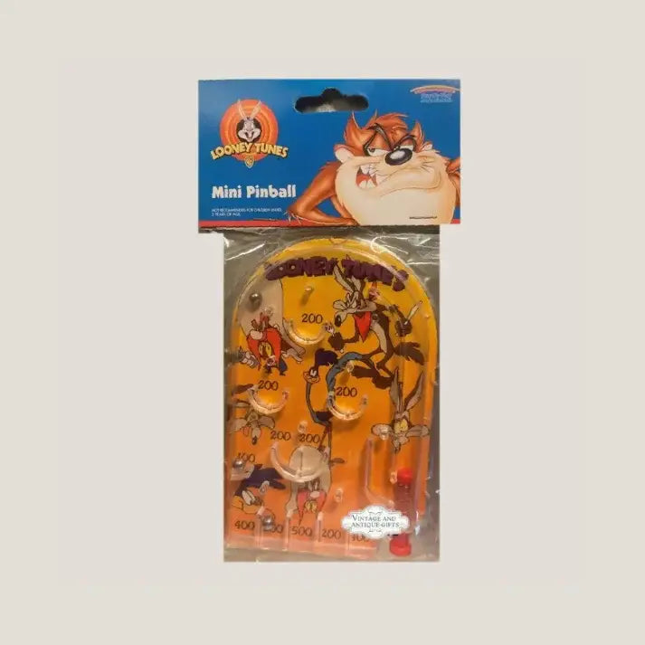 Vintage Looney Tunes pinball game in yellow plastic packaging with cartoons