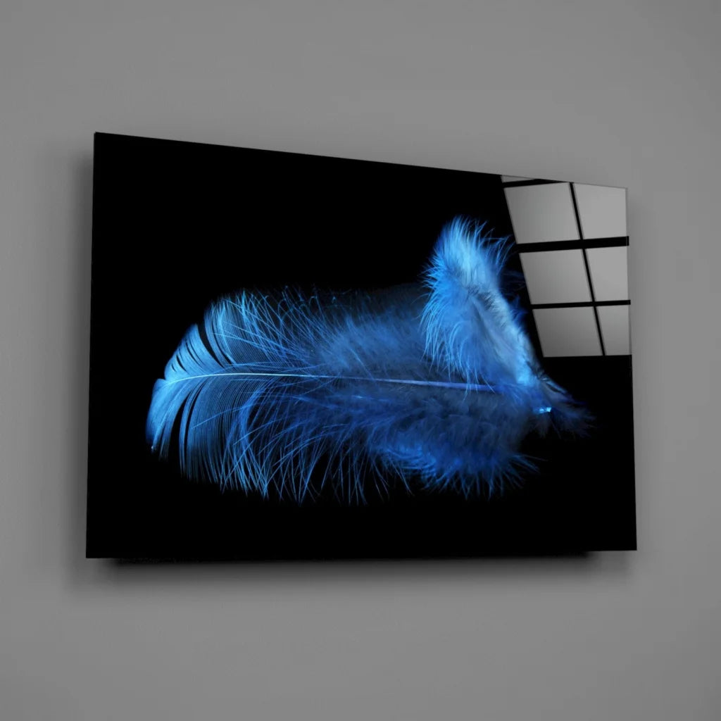 Glowing blue feather glass wall art on black canvas