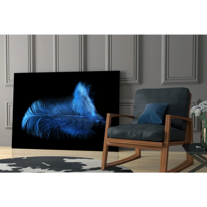 Glowing blue feather glass wall art on black canvas
