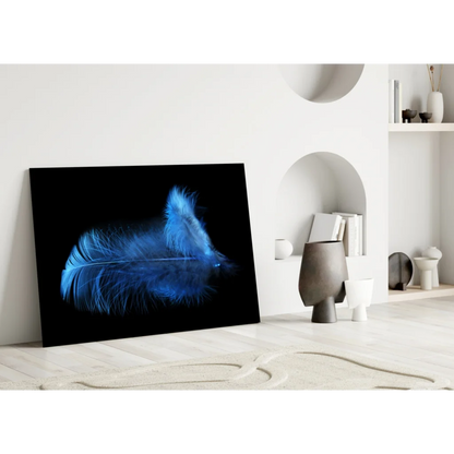Glowing blue feather glass wall art on black canvas print