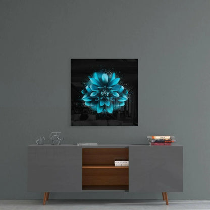 Vibrant turquoise dahlia glass wall art with glowing sparkles on black canvas