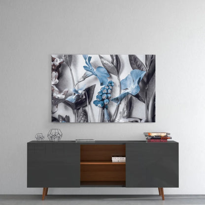 Stunning glass wall art with blue gray floral canvas print on monochrome background