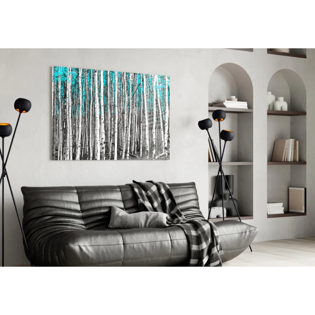 Modern black leather sofa with quilted design and gray plaid throw, near Turquoise Aspen Forest wall art