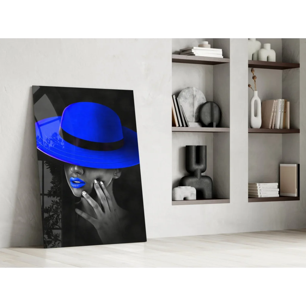 Vibrant blue fedora on woman with bold lips in monochrome glass wall art