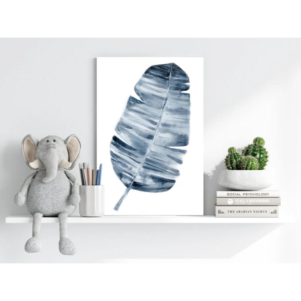 Blue elephant plush toy with gray trunk and ears on white shelf