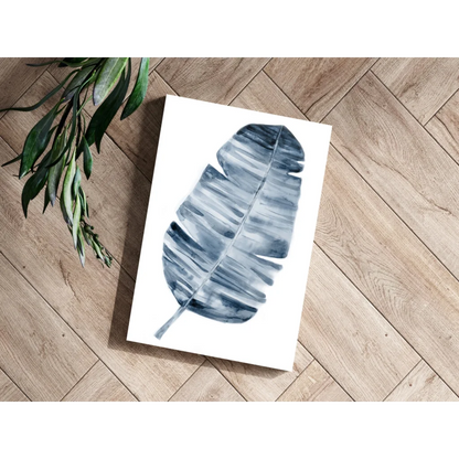 Blue leaf print on white canvas aluminum art with tropical vibes
