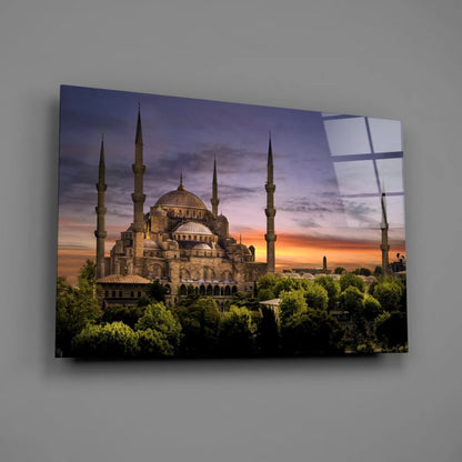 Vibrant Blue Mosque sunset glass wall art print with domes and trees