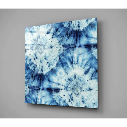 Blue tie-dye canvas wall art with abstract floral design on wall
