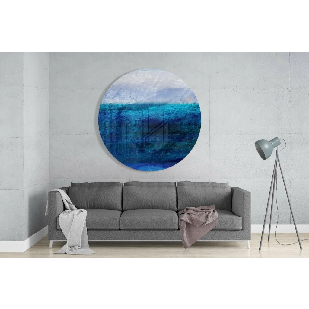 Stunning ocean blue tempered glass art with textured brushstrokes above sofa