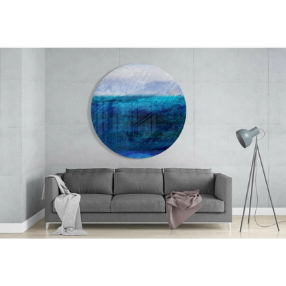 Stunning ocean blue tempered glass art with textured brushstrokes above sofa