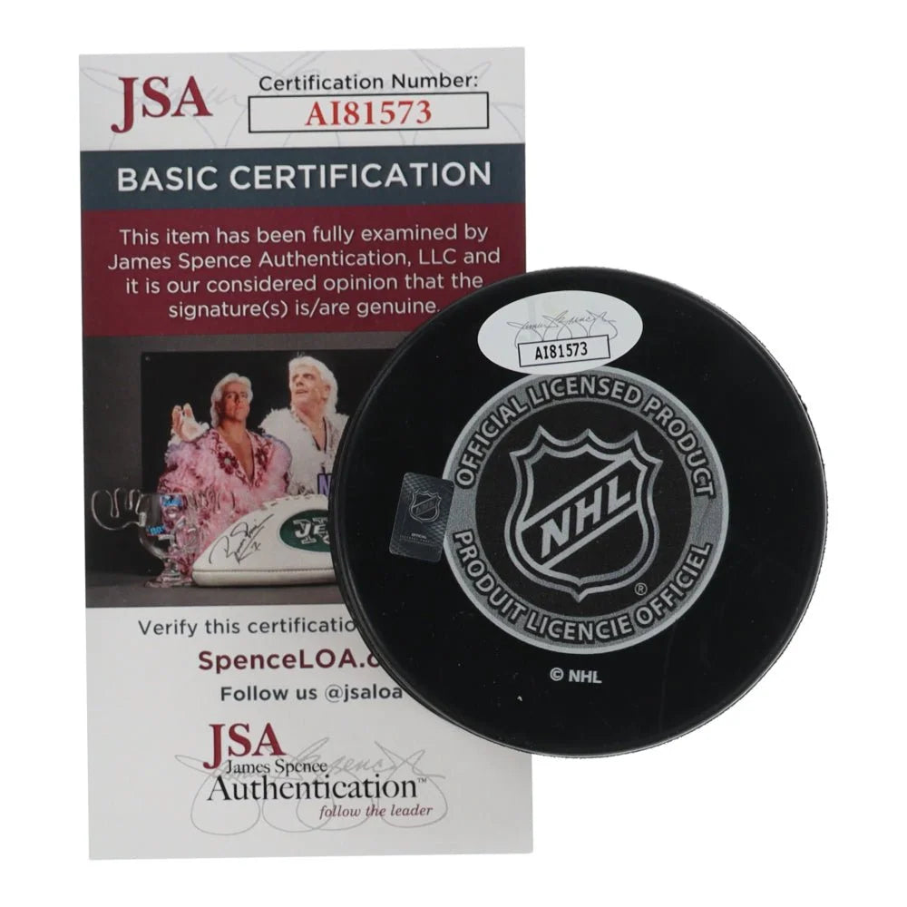 Black NHL all-star game hockey puck with JSA authentication sticker for collectors