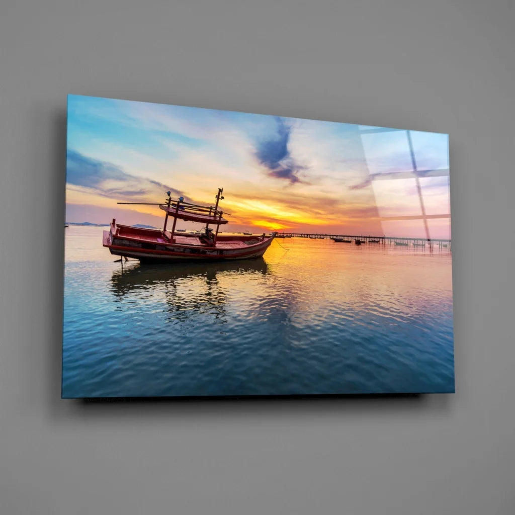Vibrant sunset fishing boat on glass wall art panel