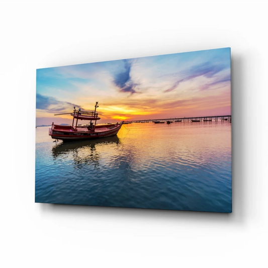Red fishing boat at sunset on glass wall art print