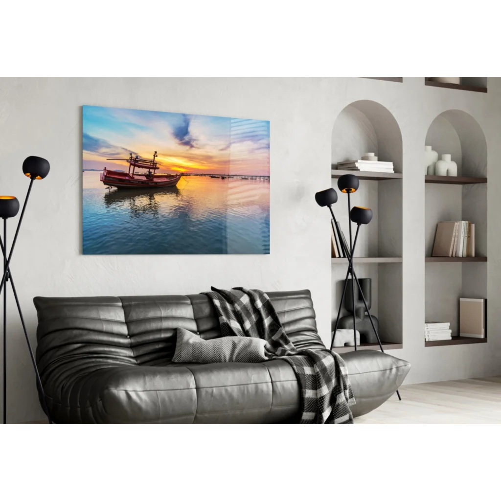 Vibrant sunset glass wall art print with red fishing boat on calm water