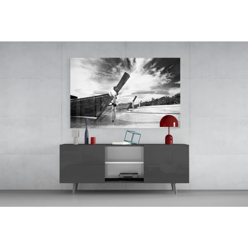 Black and white longtail boat canvas wall art with upward propeller against dramatic sky