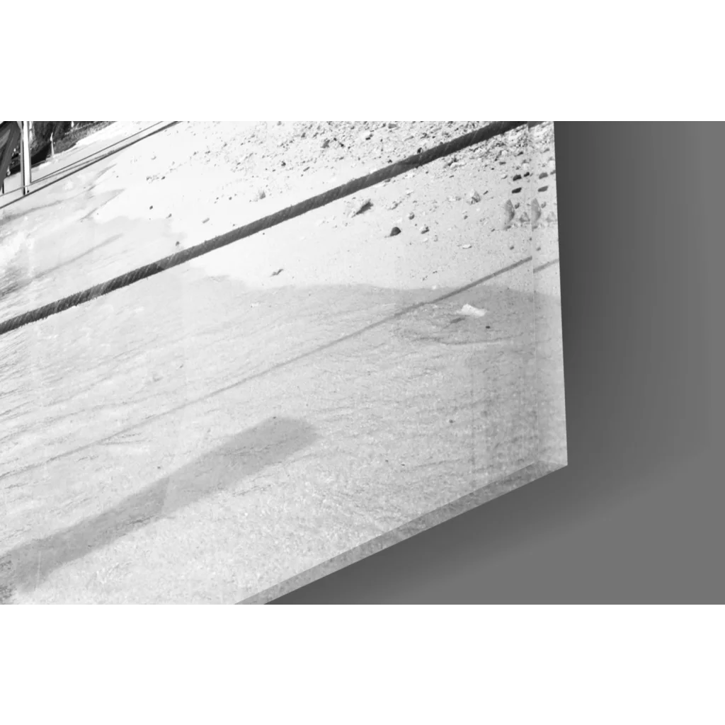 Sleek black-and-white glass wall art of longtail boats on beach