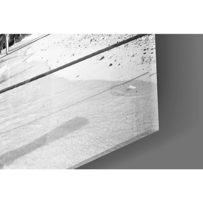 Sleek black-and-white glass wall art of longtail boats on beach