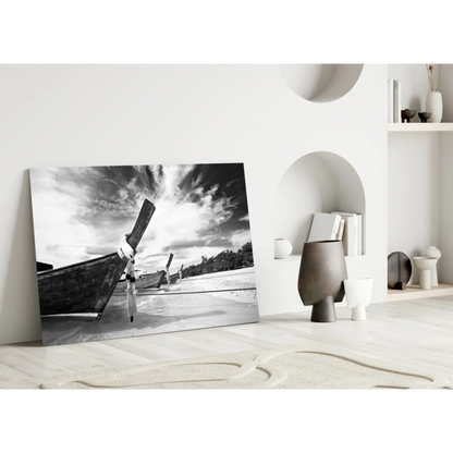 Black-and-white canvas wall art of longtail boats on beach under dramatic sky