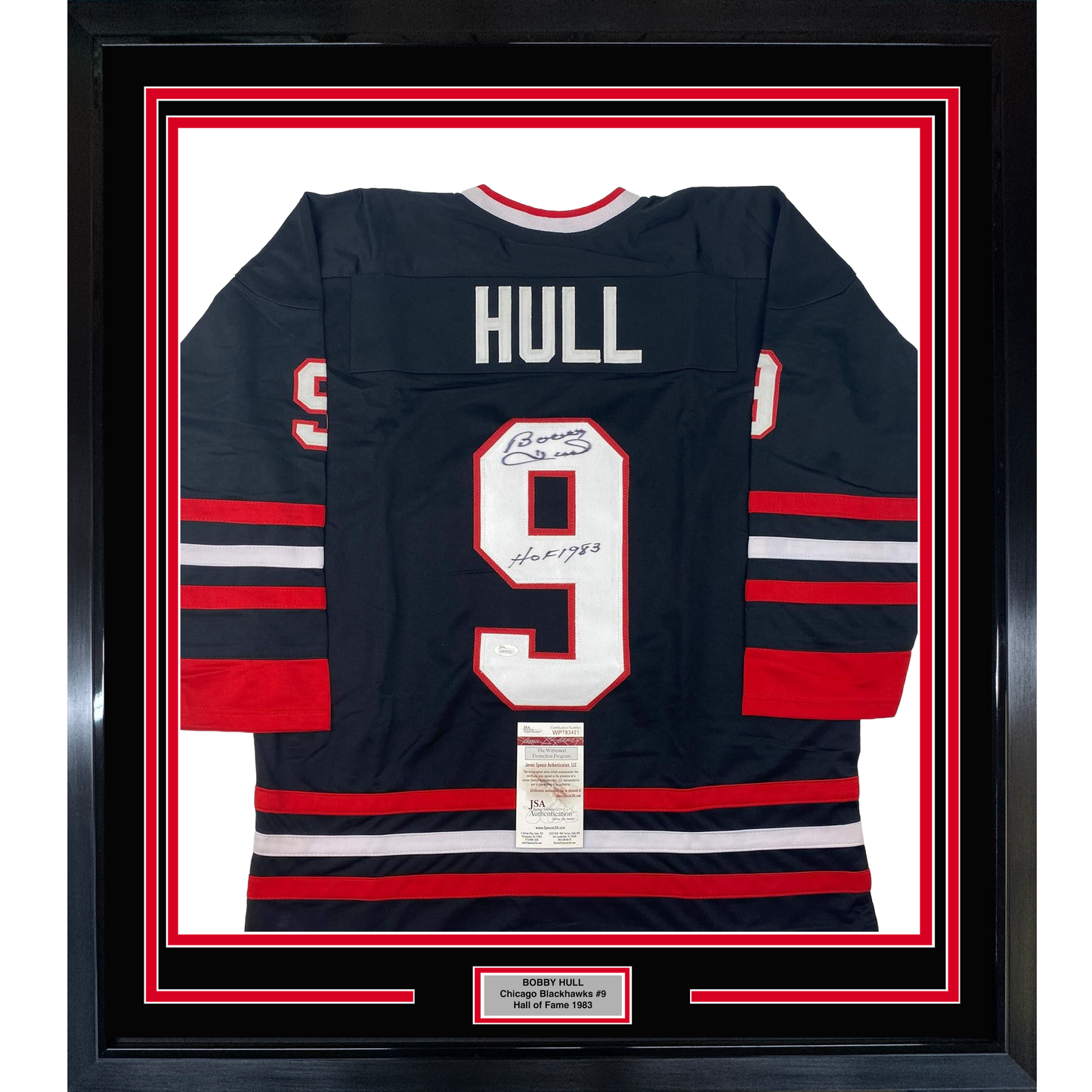 Framed Chicago Blackhawks jersey number 9 with "HULL" nameplate, navy with red and white stripes, displaying autograph and JSA authentication certificate.