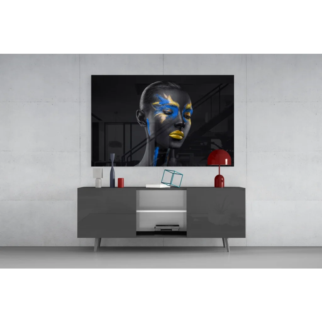 Samsung QLED TV on bold abstract face paint wall art in black and gold