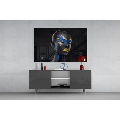 Samsung QLED TV on bold abstract face paint wall art in black and gold