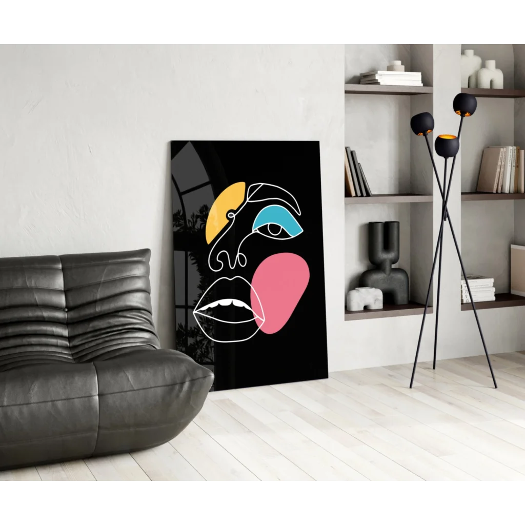 Bold geometric face glass wall art in vibrant yellow, blue, pink on black canvas