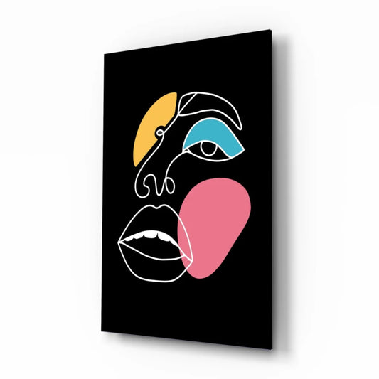 Bold geometric face glass wall art in yellow, blue, pink on black canvas