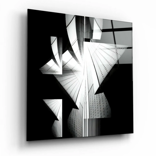 Bold black and white geometric glass wall art with triangles