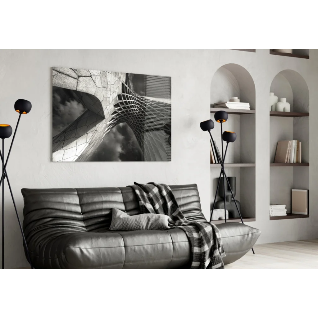 Modern silver leather sofa with black and white glass wall art throw