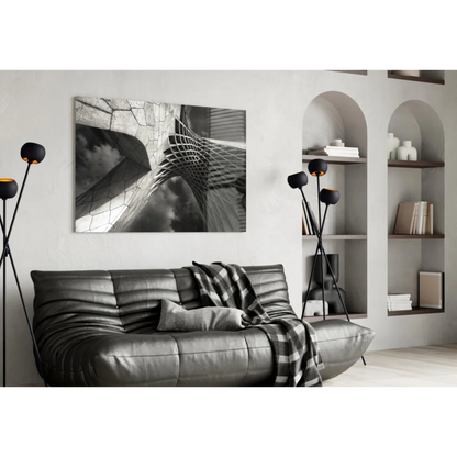 Modern silver leather sofa with black and white glass wall art throw