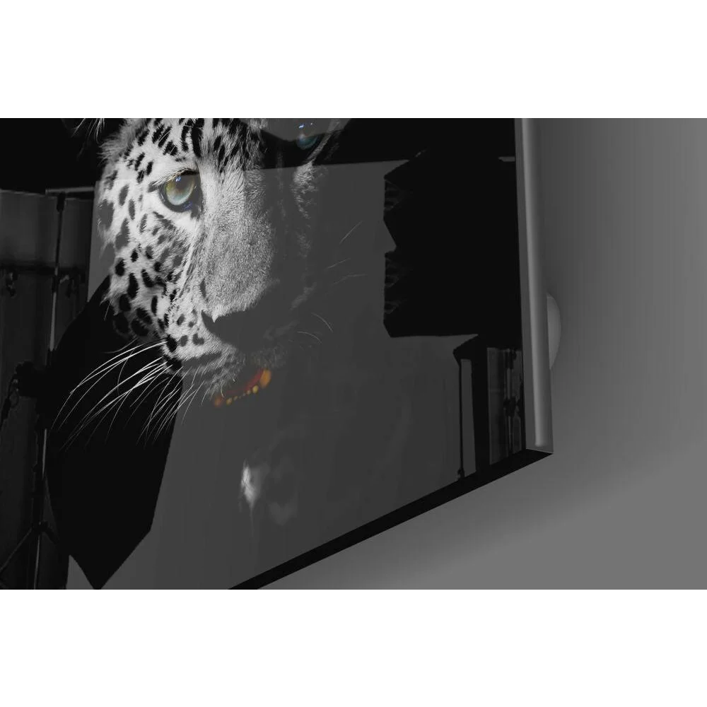 Bold black and white leopard print glass wall art with orange pop