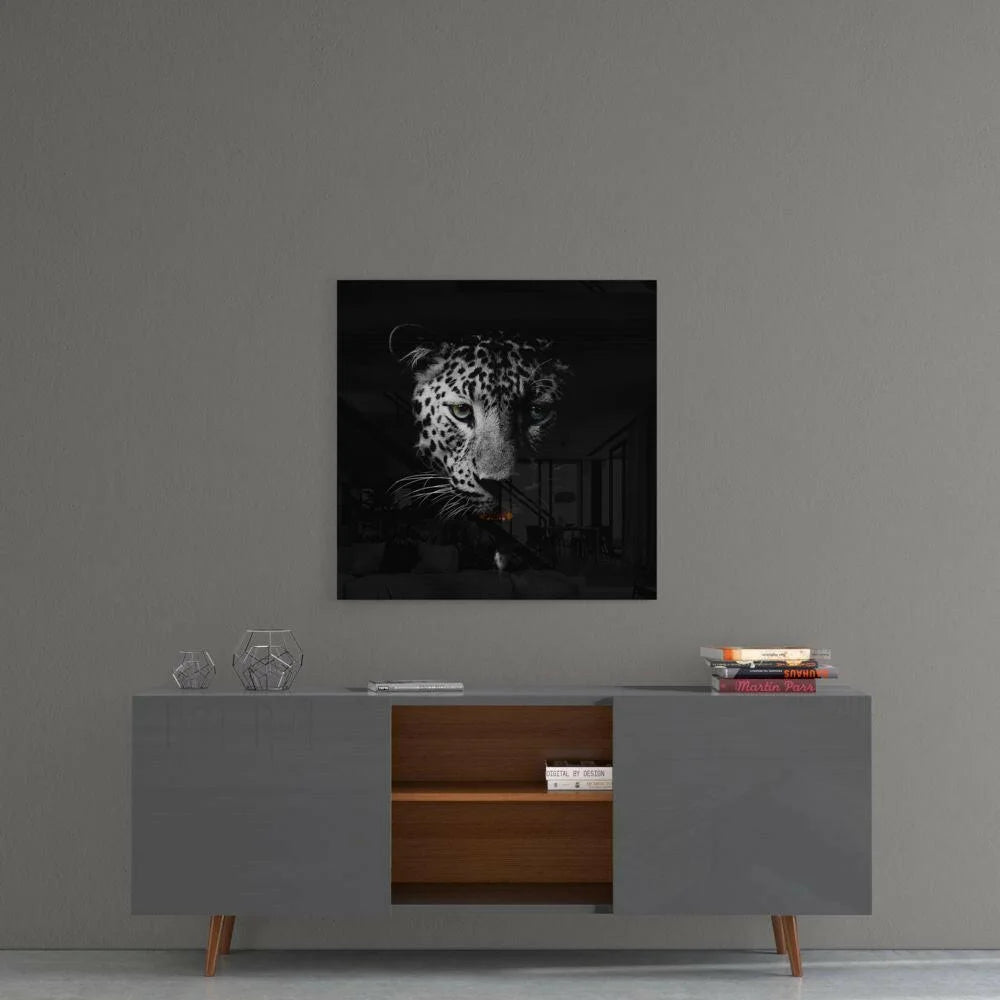 Bold black and white snow leopard wall art print on gray wall