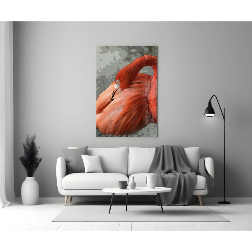 Modern white sofa with gray throw and black metal legs under Bold Red Flamingo glass wall art