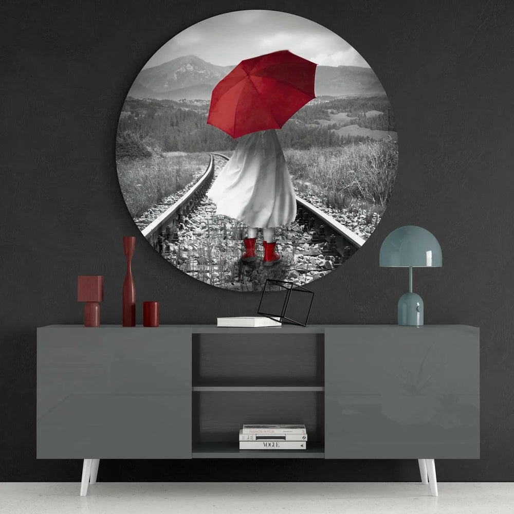 Bold red umbrella woman on tracks in tempered glass art circle
