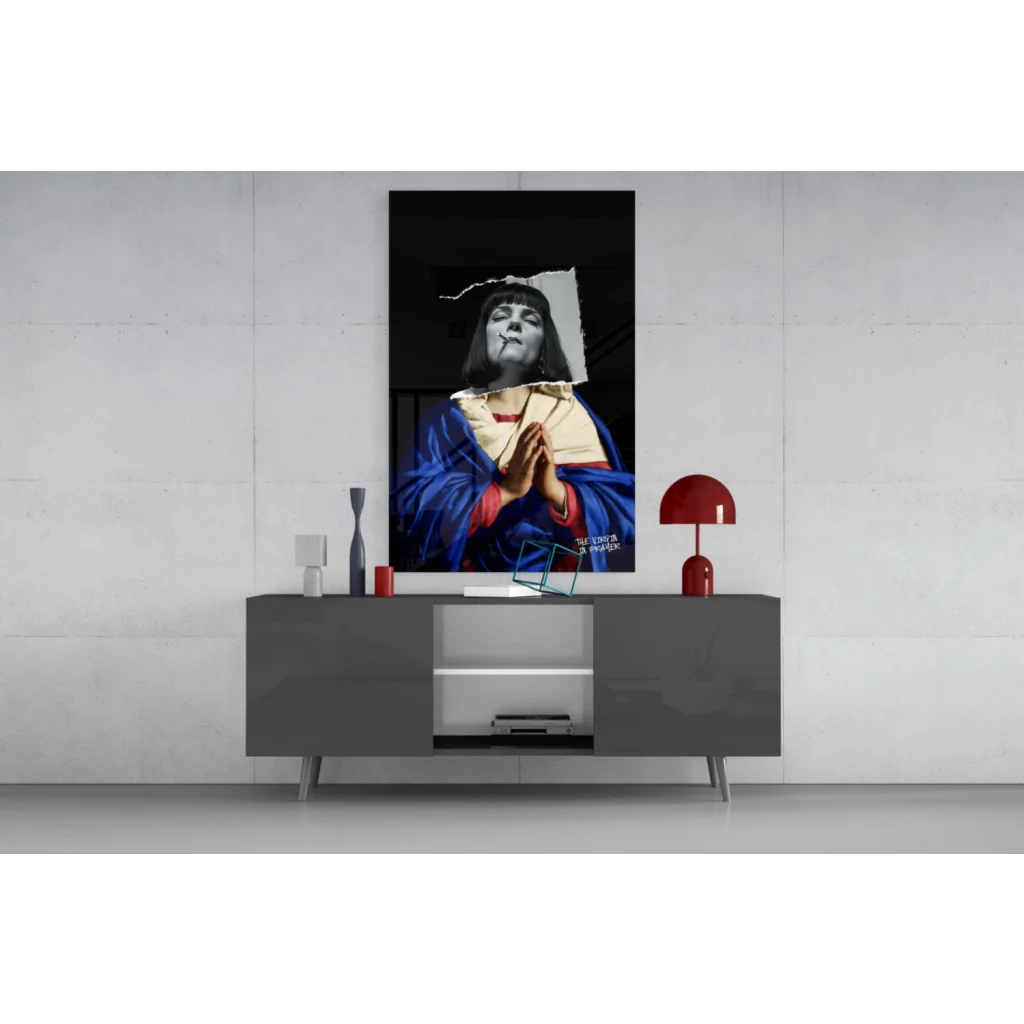 Black and white robed figure in prayer on bold red-accented glass wall art