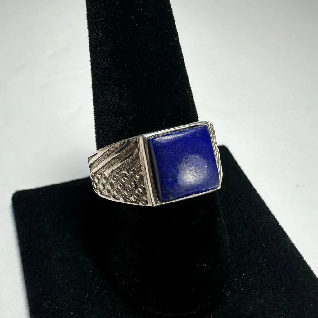 Bold lapis lazuli ring in sterling silver with ornate textured band