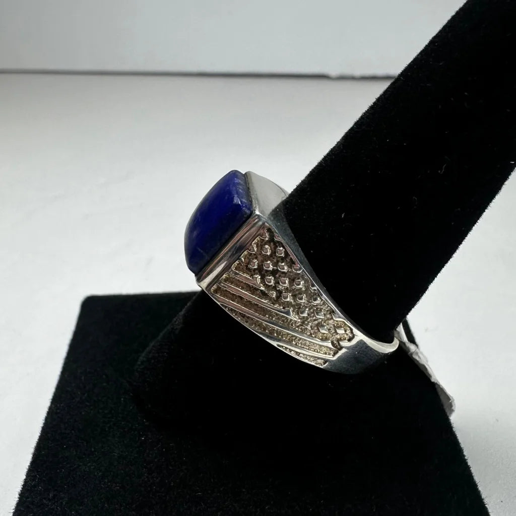 Bold silver lapis lazuli ring with ornate geometric band