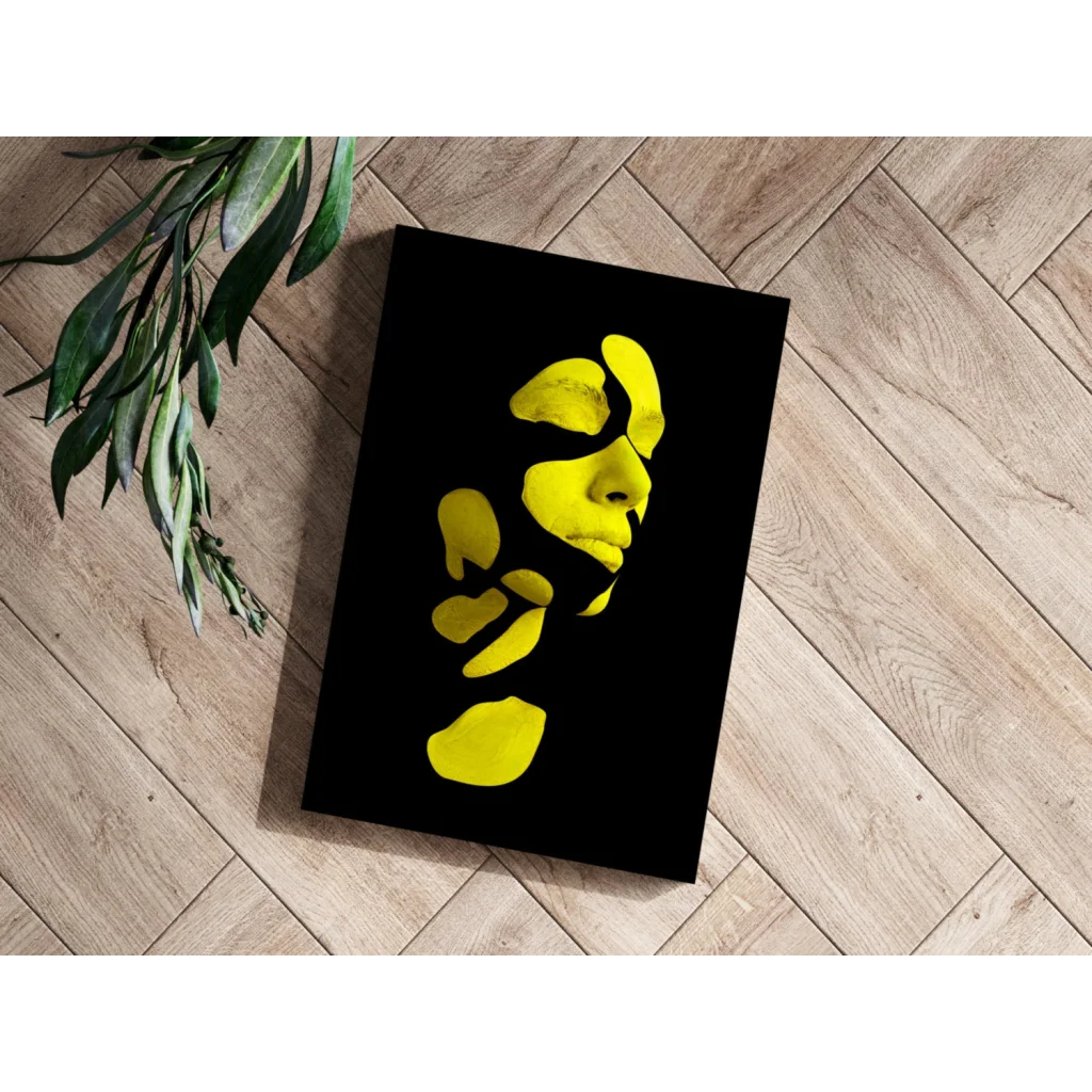 Bold yellow face abstract canvas print in black frame for modern decor