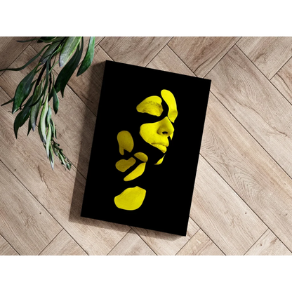 Bold yellow face abstract canvas print in black frame for modern decor