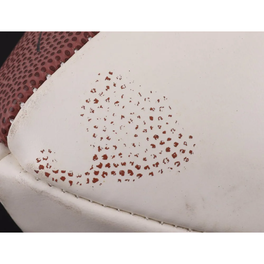 White athletic shoe with red leopard print design for Super Bowl XXXVII logo display