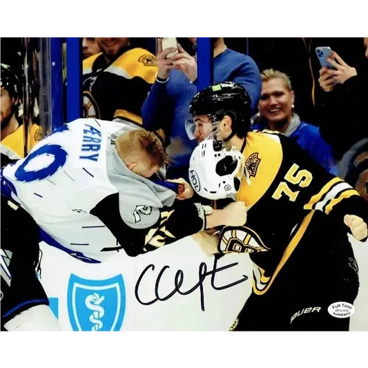 Autographed 8x10 photo of Boston Bruins players fighting with authentication card
